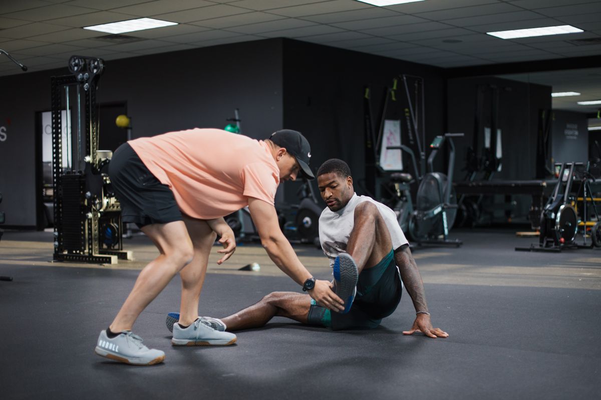 Trainer-assisted stretching session